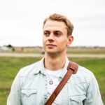Caucasian young man portrait at park